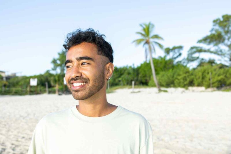 happy man at beach 1446061460
