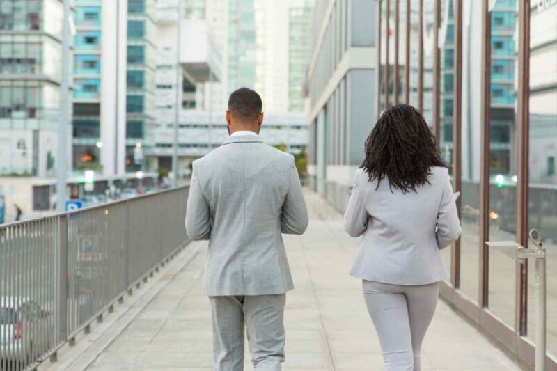 two professionals walking away 1197819338
